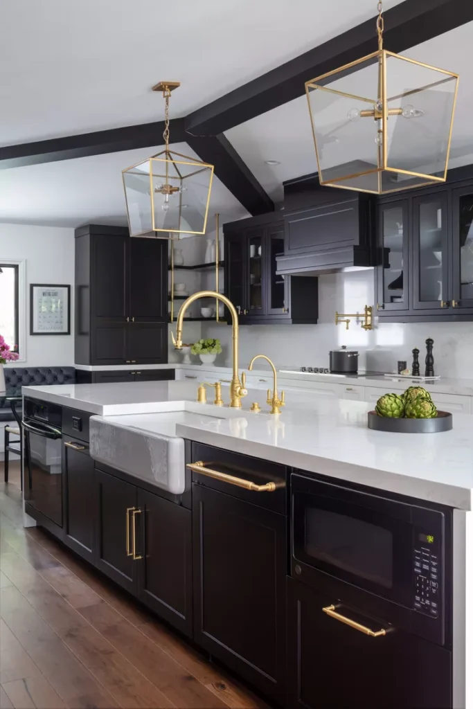 Black and white kitchen with brass sinks and hardware