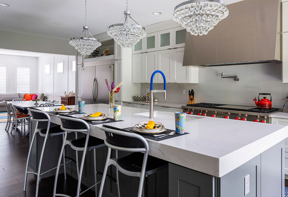 White accent kitchen with build-in sink on larger marble counter top