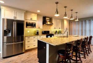 Moehl Millwork provided cabinets and countertops for this kitchen island.