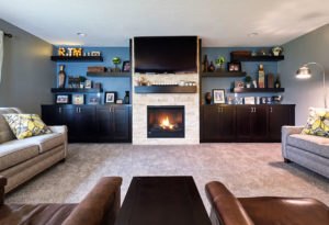 Moehl Millwork provided cabinets and shelves for this living room.