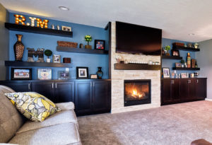 Moehl Millwork provided cabinets and shelves for this living room.